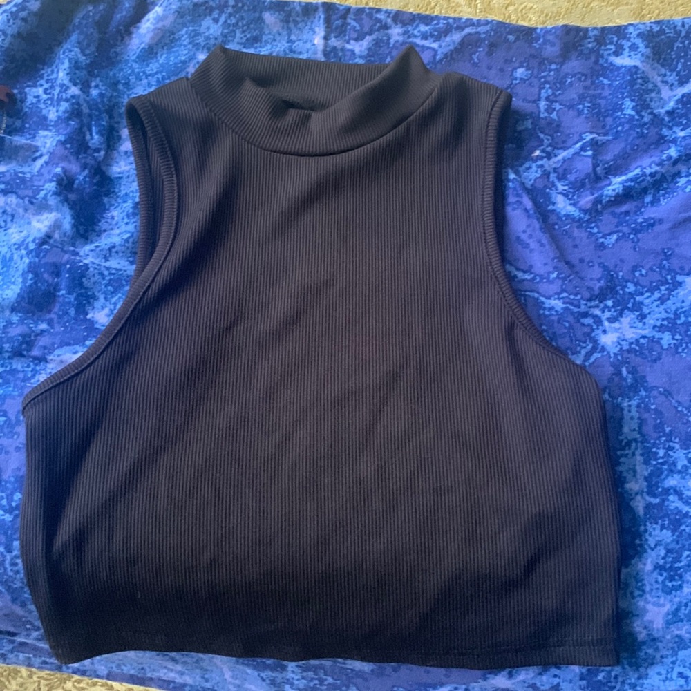 High-styled neck on this black silk crop top. Very stretchy and comfortable.